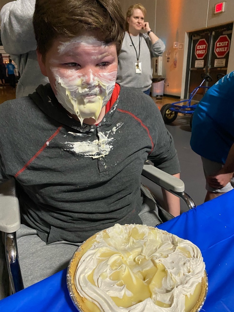 Student eating a pie  